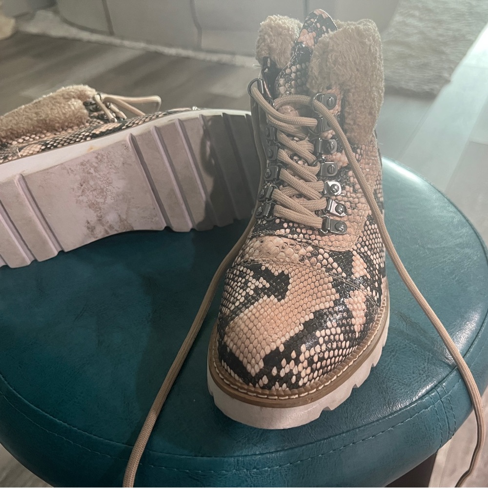 Faux fur trimmed reptile print winter boots. Lace up.